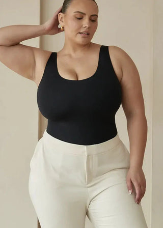 woman wearing pinsy shapewear scoop tank hourglass shapewear bodysuit in black