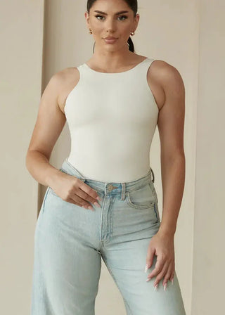 woman wearing pinsy shapewear high neck hourglass shapewear bodysuit in  cream