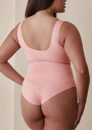 Woman wearing Pinsy Shapewear Scoop Neck Hourglass Shapewear Bodysuit in Petal Pink