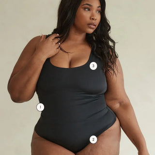 Plus size model wearing Pinsy Shapewear Black Scoop Neck Shapewear Bodysuit