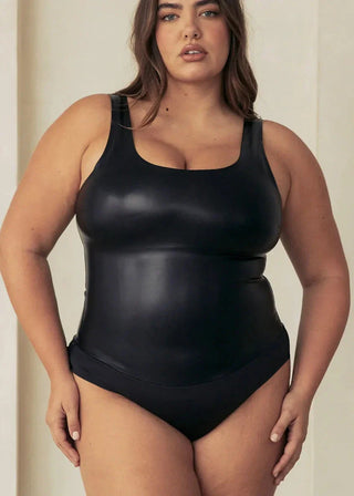 Woman Wearing Pinsy Shapewear Vegan Leather Scoop Neck Shapewear Bodysuit in Black
