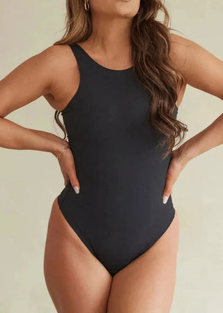 Woman Wearing Pinsy Shapewear High Neck Hourglass Shapewear Thong Bodysuit in Black
