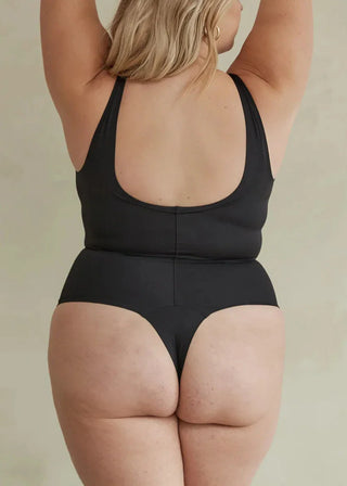 Woman Wearing Pinsy Shapewear High Neck Hourglass Shapewear Thong Bodysuit in Black