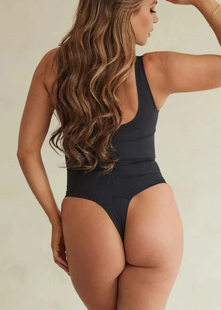 Woman Wearing Pinsy Shapewear Scoop Neck Hourglass Shapewear Thong Bodysuit in Black
