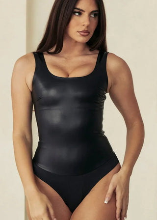 Woman Wearing Pinsy Shapewear Vegan Leather Scoop Neck Shapewear Bodysuit in Black