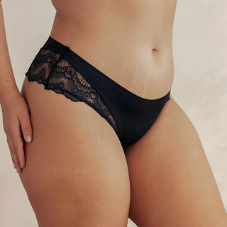 Woman wearing Pinsy Shapewear Black Lace Thong Panty