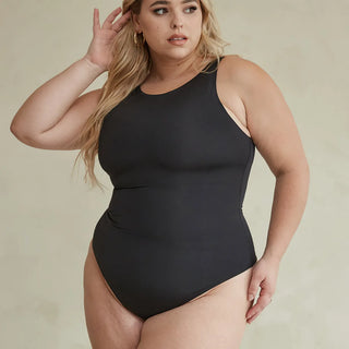 Woman Wearing Pinsy Shapewear High Neck Hourglass Shapewear Cheeky Bodysuit in Black