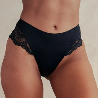Woman wearing Pinsy Shapewear Mid-Waist Smoothing Black Lace Hipster Panty