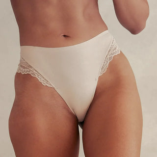 Woman wearing Pinsy Shapewear Mid-Waist Smoothing Beige Lace Hipster Panty